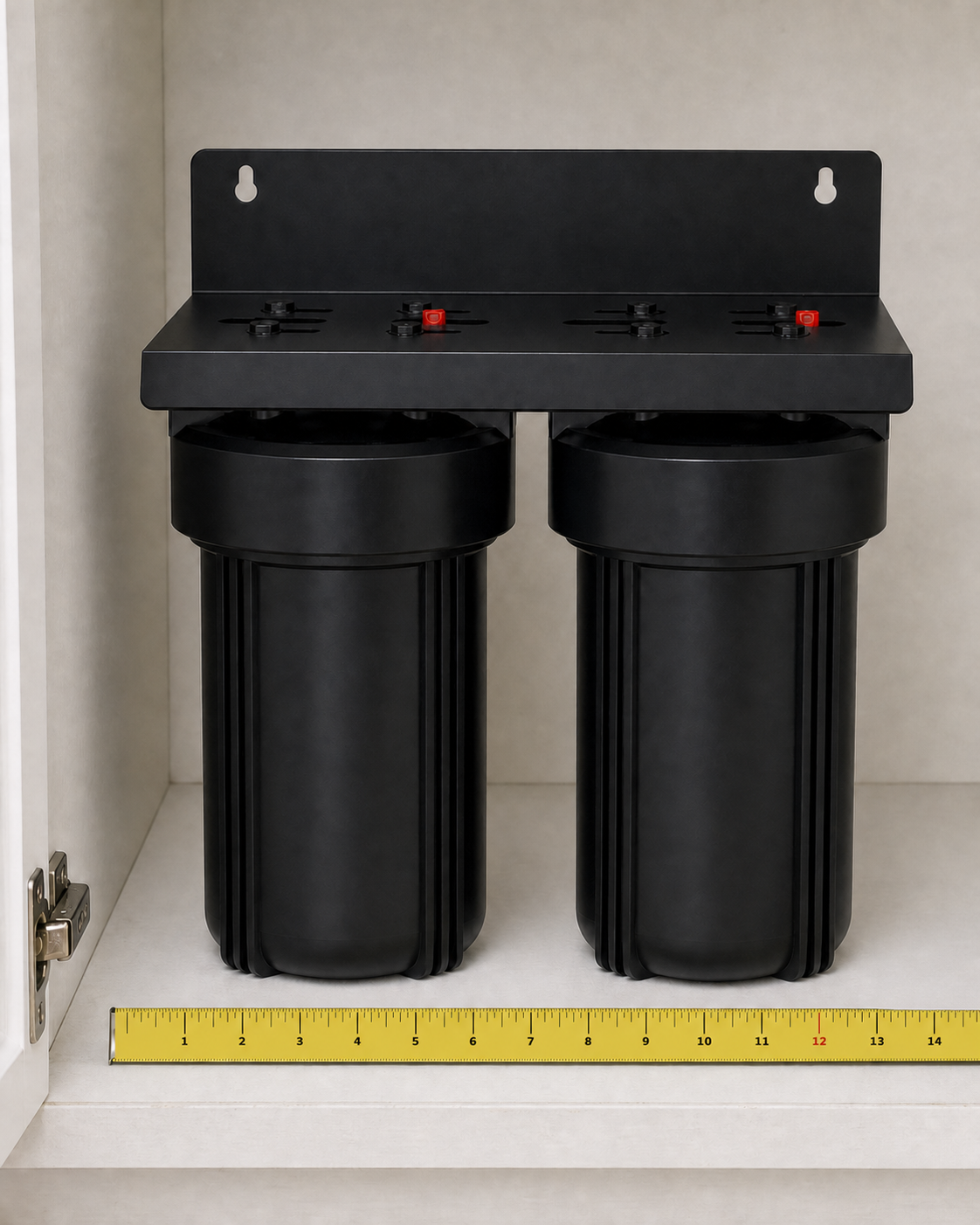 The Mule — under-sink dual housing drinking water filter shown inside a cabinet with tape measure